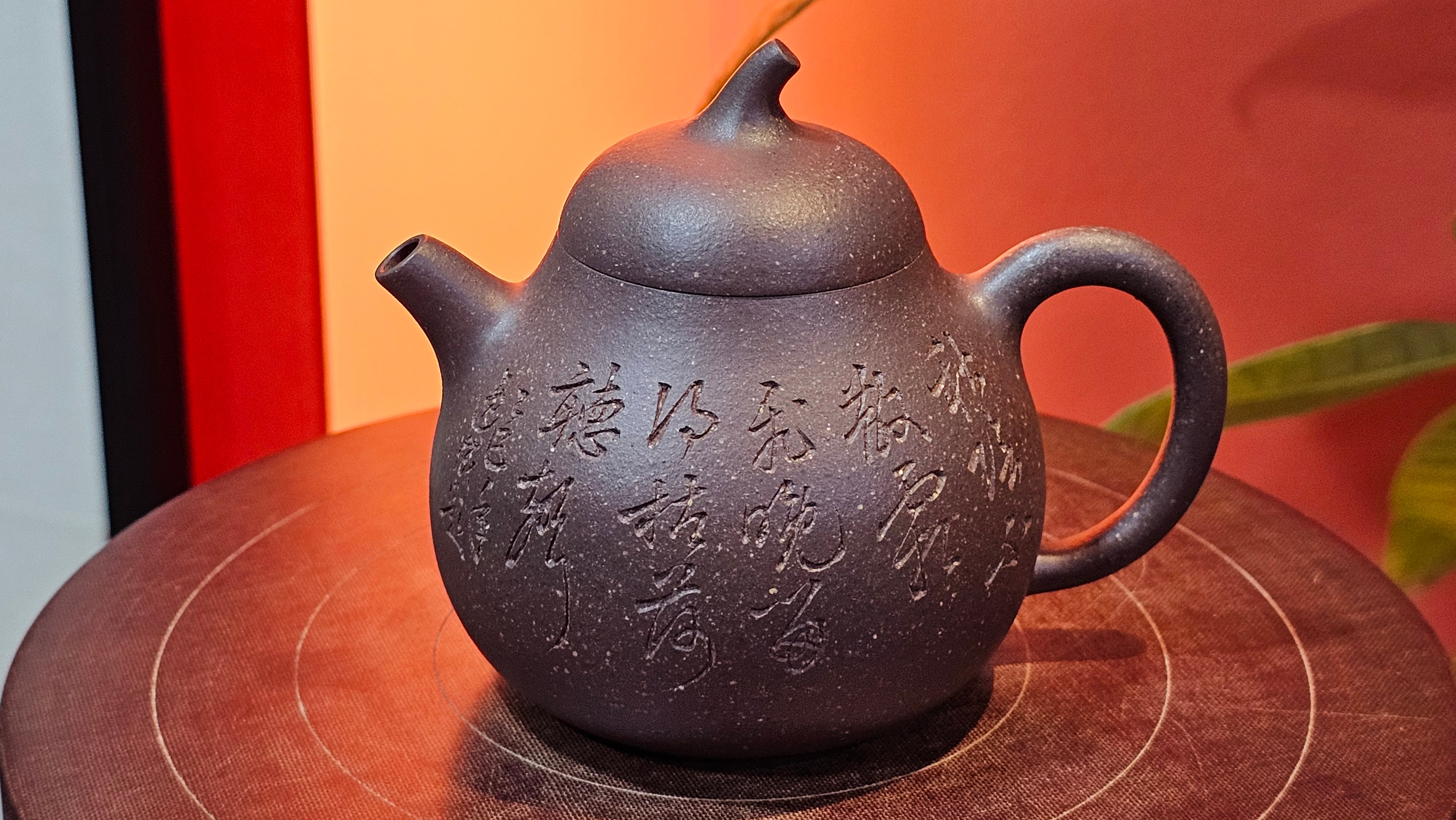 Qie Gua《茄瓜》~ "The Gourd", 152.8ml, Hei Zi Ni 黑紫泥, by our Craftsman Zhang Huan 张欢, Calligraphy and Lotus Engraving by Craftsman Yi Cheng 逸成 ~ Congratulations!to Dr L.L.! 1327hrs 19th Sept 2025! Ventura, CA!